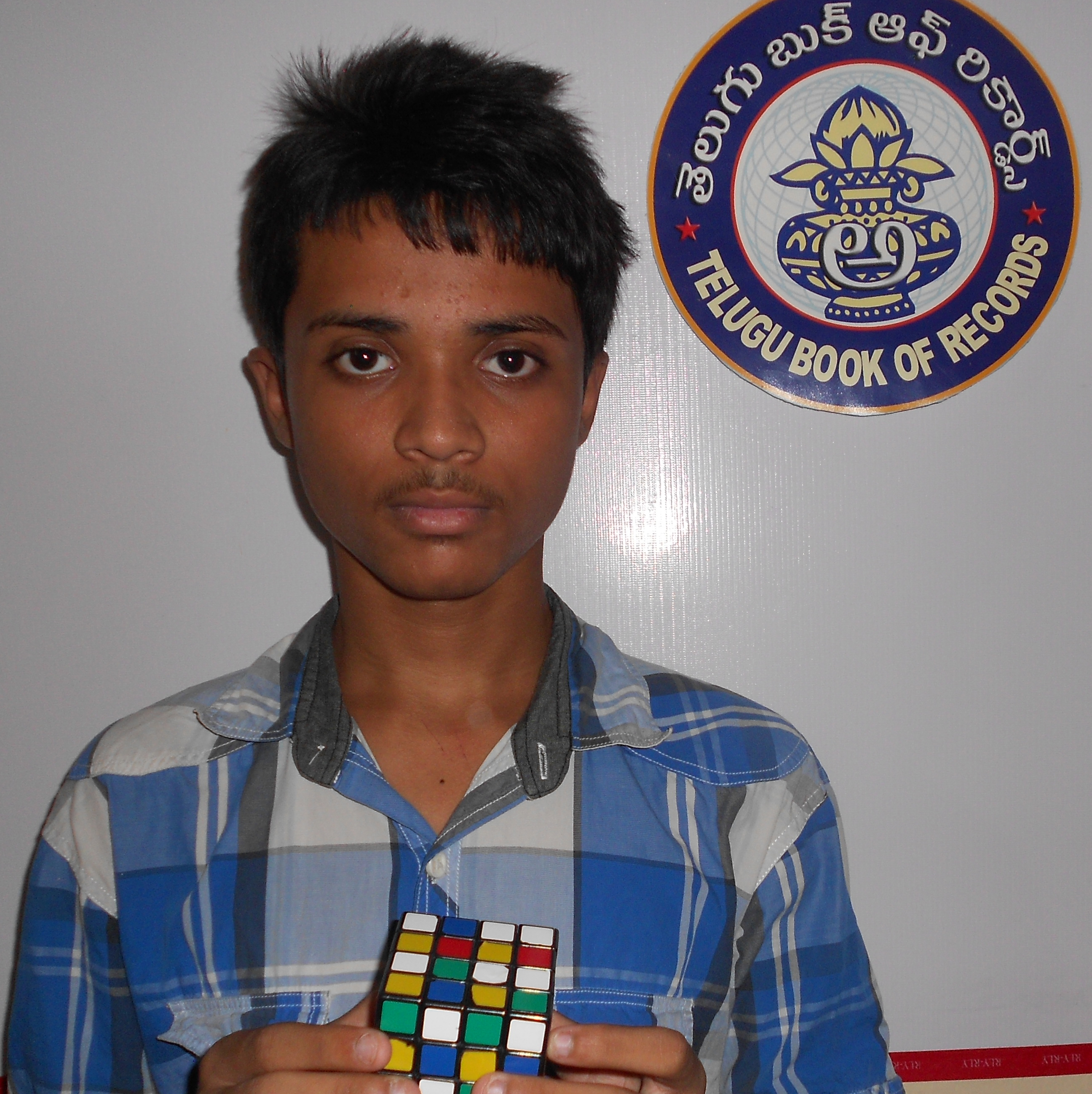 FASTEST TIME TO SOLVE A RUBIK’S CUBE 4X4  WHILE STANDING ON ONE FOOT AND SINGING A SONG ‘ VANDEMATARAM ‘
