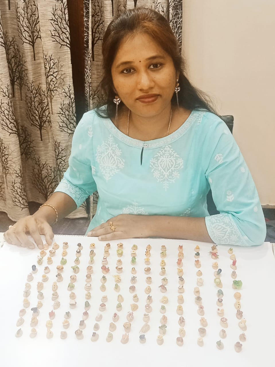 MOST NUMBERS OF MICRO CLAY ART  MADE ON PISTA SHELLS